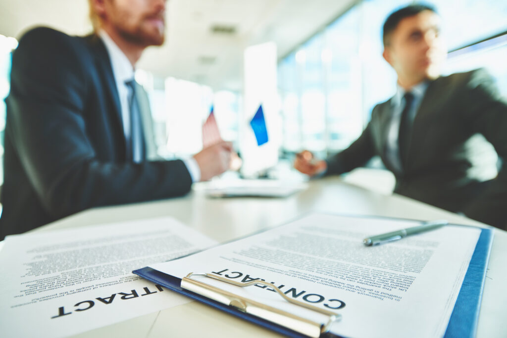 Employment Lawyer Guide: Wrongful Termination, Discrimination & Workplace Rights in Kosovo 1 This image has an empty alt attribute; its file name is signing-contracts-1024x683.jpg